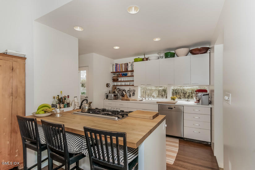 25 Willowmere Avenue Riverside, CT 06878 - Photo 14 of 24 a kitchen with a table and chairs in it