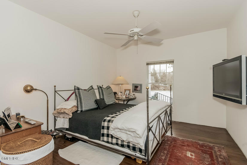 25 Willowmere Avenue Riverside, CT 06878 - Photo 15 of 24 a bedroom with a bed and a flat screen tv