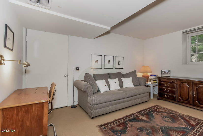 25 Willowmere Avenue Riverside, CT 06878 - Photo 19 of 24 a living room with furniture and wooden floor