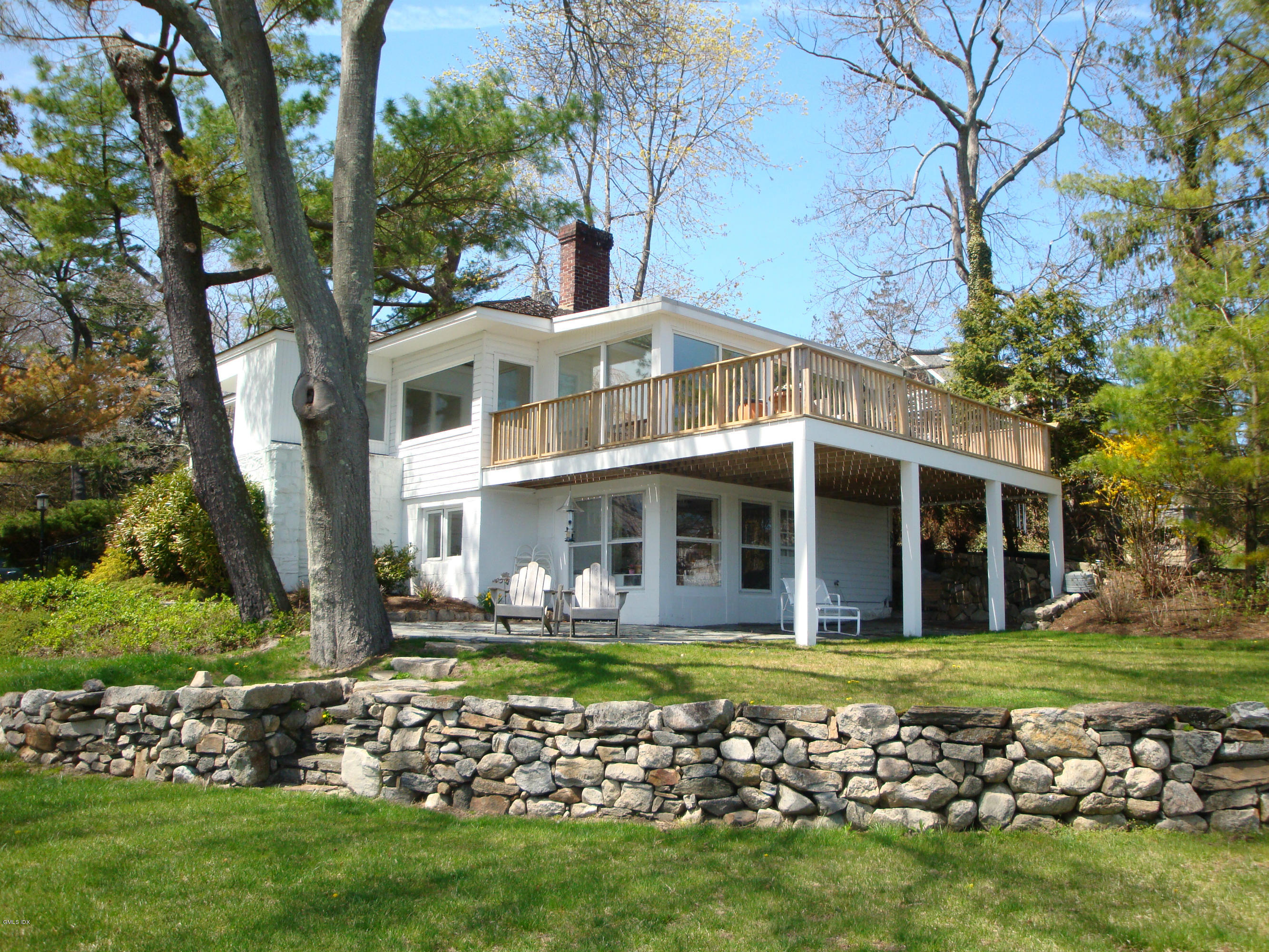25 Willowmere Avenue Riverside, CT 06878 - Photo 4 of 24 a front view of a house with a garden