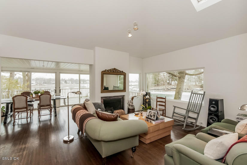 25 Willowmere Avenue Riverside, CT 06878 - Photo 8 of 24 a living room with furniture and a floor to ceiling window