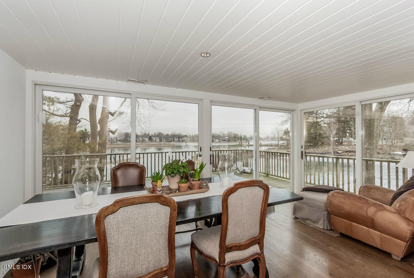25 Willowmere Avenue Riverside, CT 06878 - Photo 10 of 24 a living room with furniture and a floor to ceiling window
