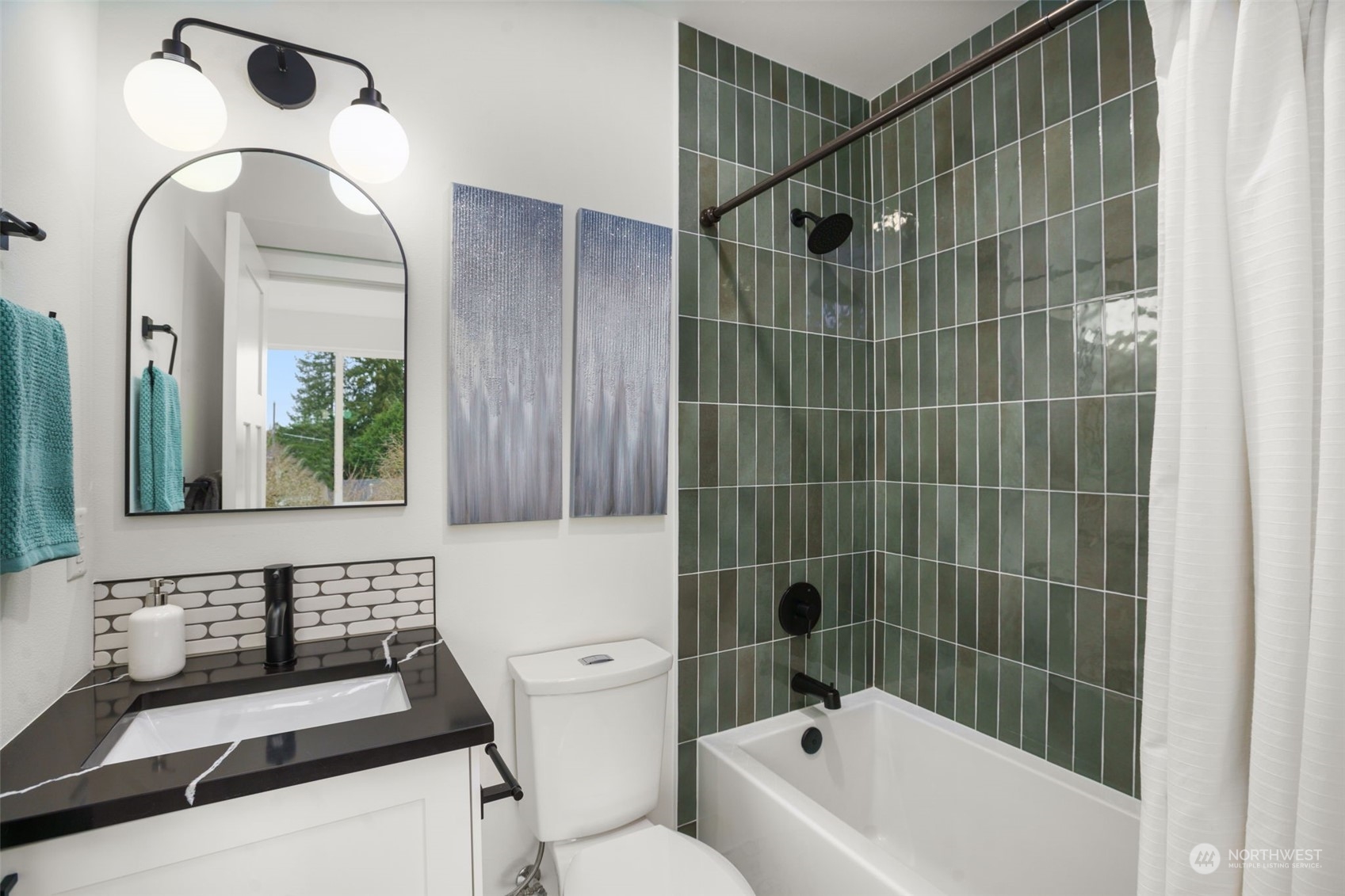 8849 30th Avenue Southwest Seattle, WA 98126 - Photo 24 of 37 a bathroom with a sink a toilet and a bathtub