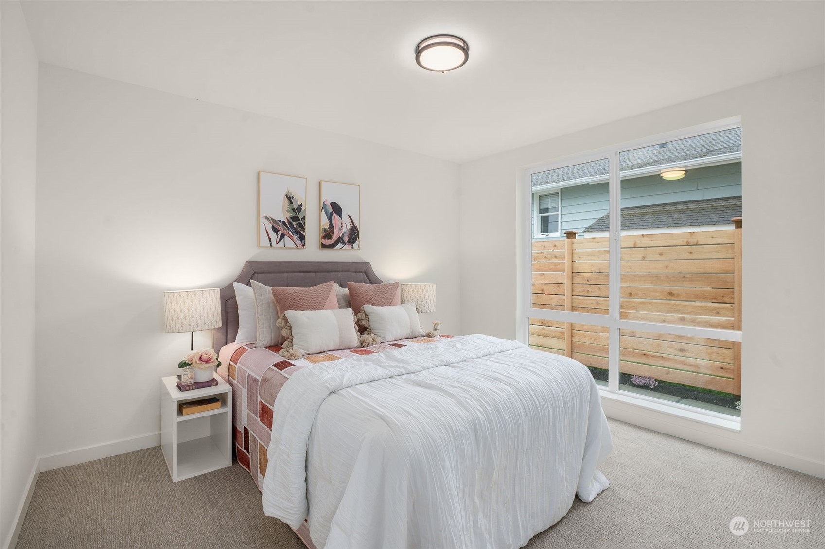 8849 30th Avenue Southwest Seattle, WA 98126 - Photo 26 of 37 a bedroom with a bed and a window