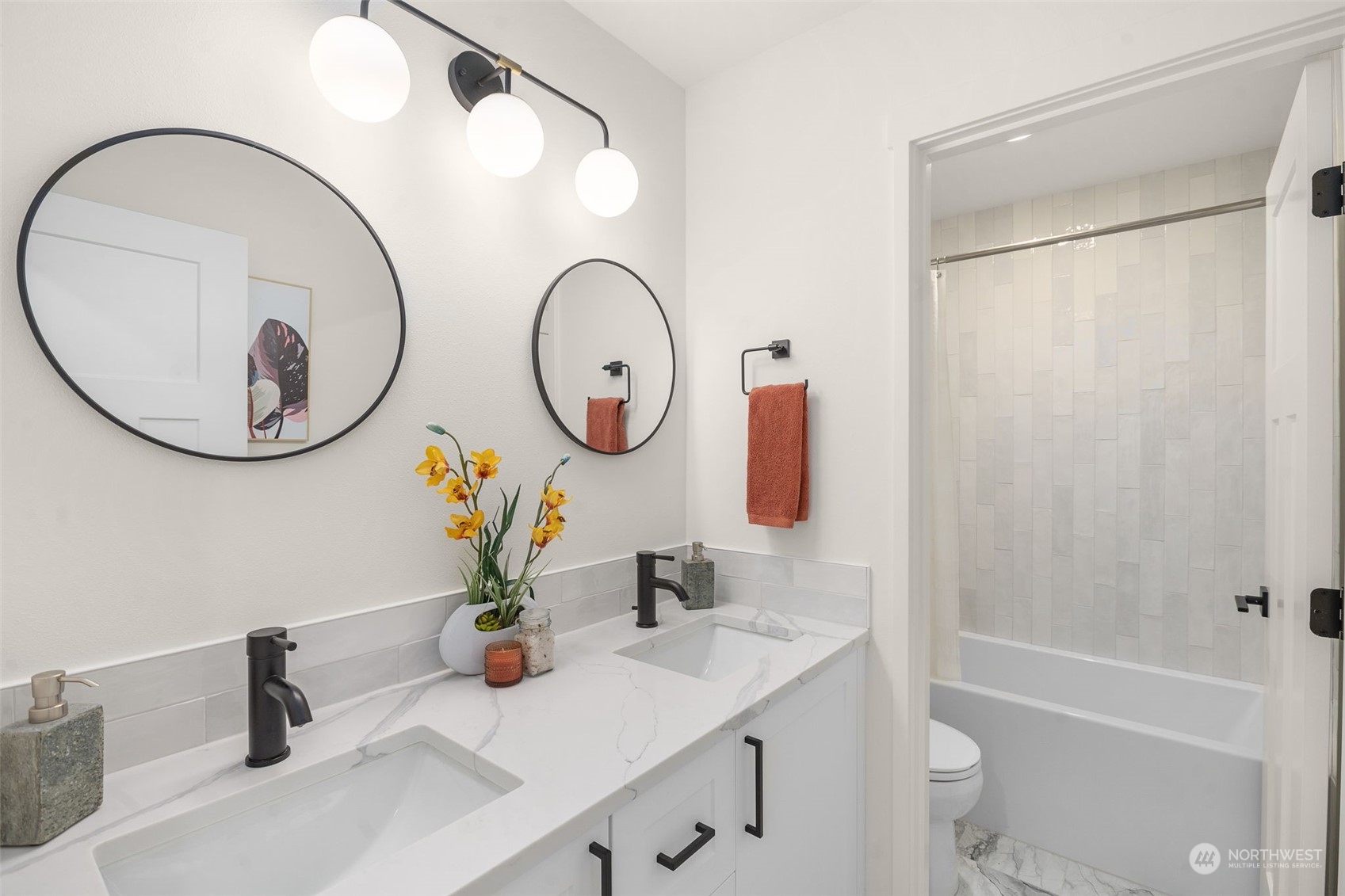8849 30th Avenue Southwest Seattle, WA 98126 - Photo 27 of 37 a bathroom with a sink a toilet and a mirror