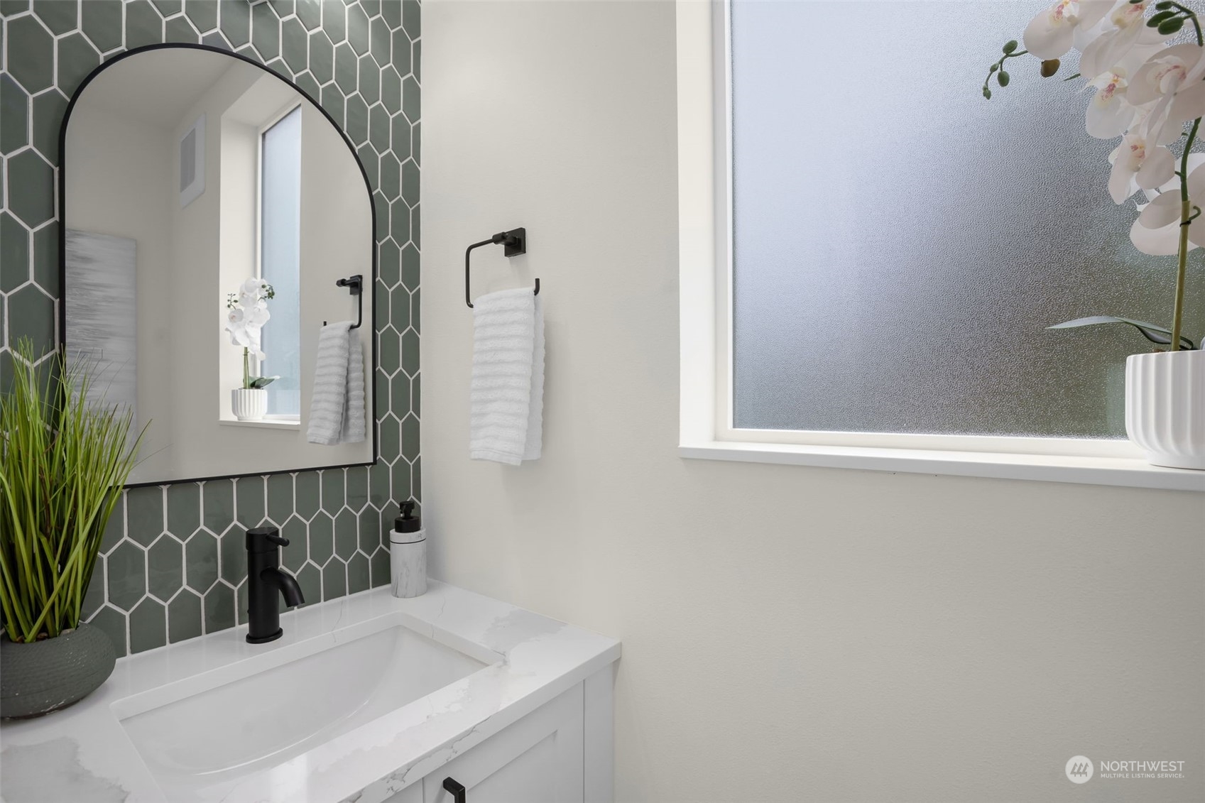 8849 30th Avenue Southwest Seattle, WA 98126 - Photo 29 of 37 a bathroom with a sink and a mirror