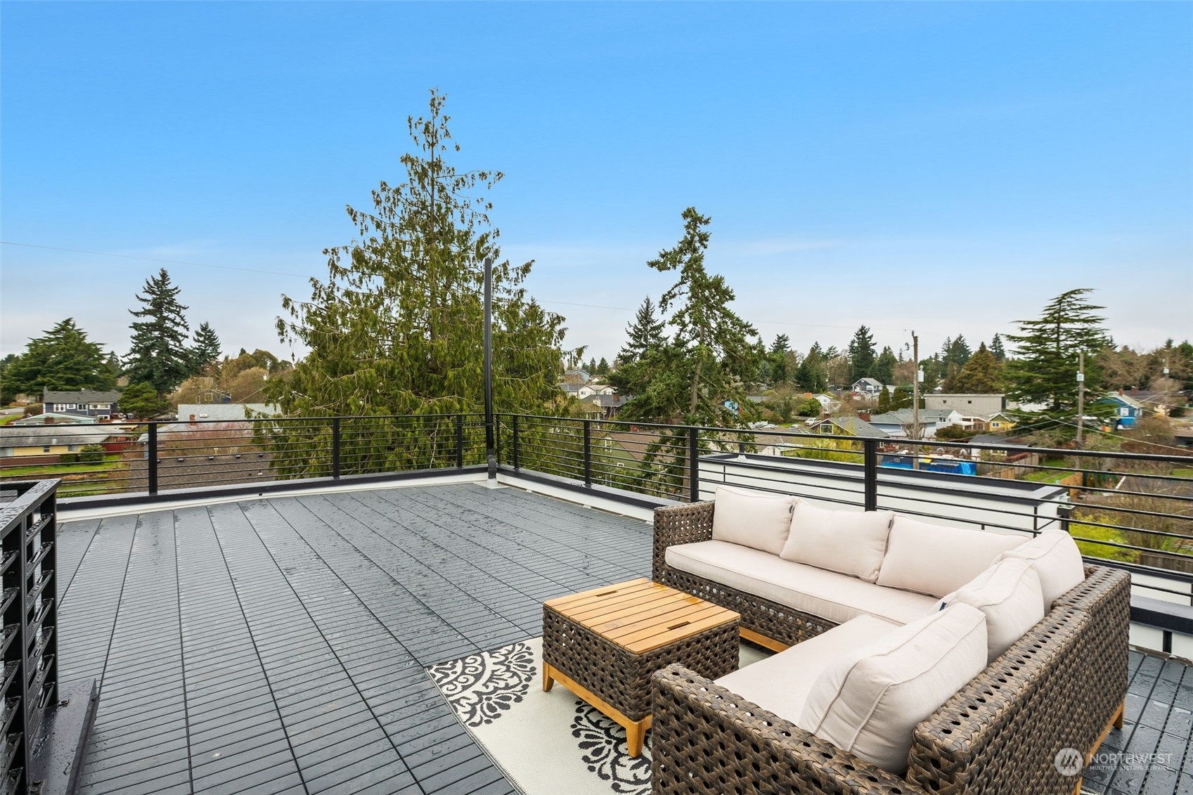8849 30th Avenue Southwest Seattle, WA 98126 - Photo 30 of 37 a view of roof deck with couches and wooden floor