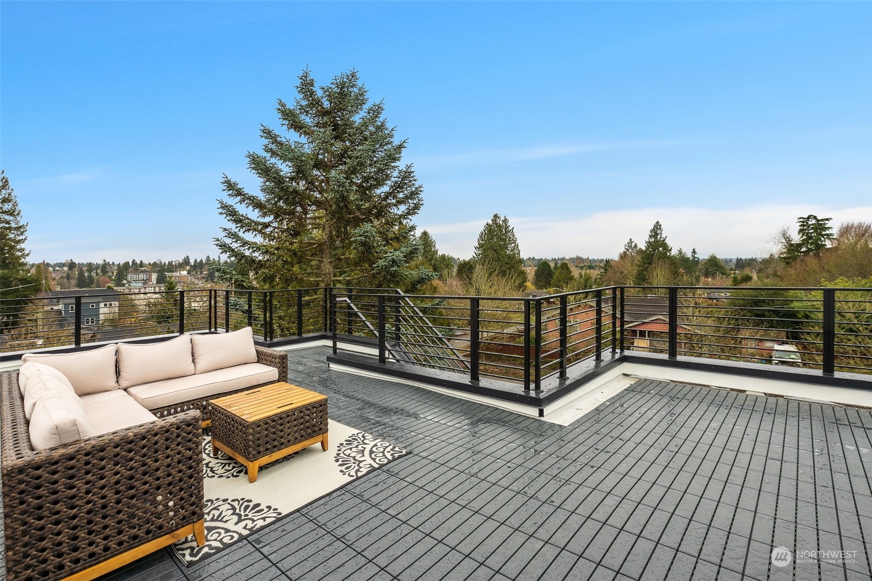 8849 30th Avenue Southwest Seattle, WA 98126 - Photo 32 of 37 a view of a terrace with couches and sky view