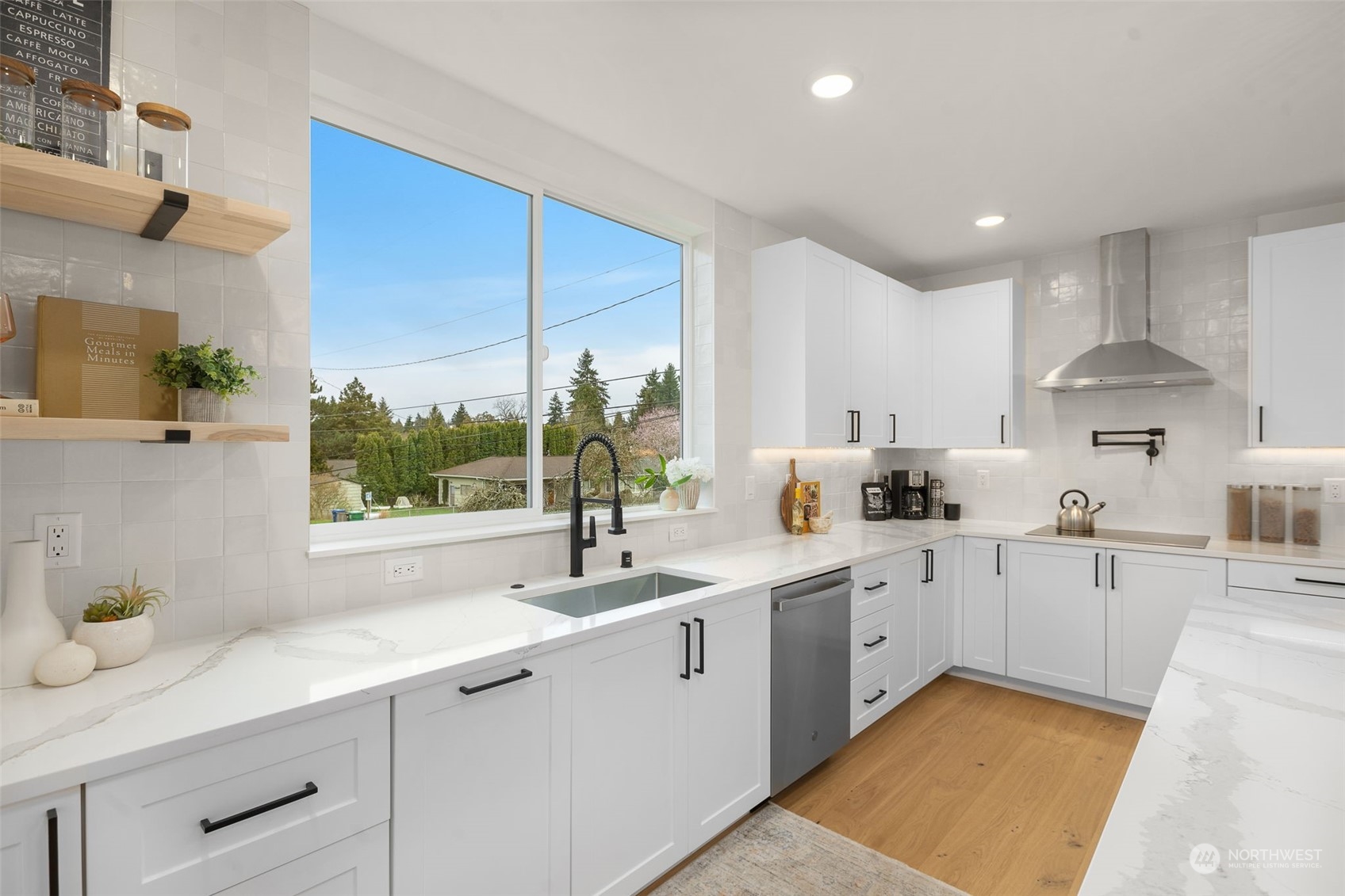 8849 30th Avenue Southwest Seattle, WA 98126 - Photo 10 of 37 a kitchen filled with white cabinets and white appliances