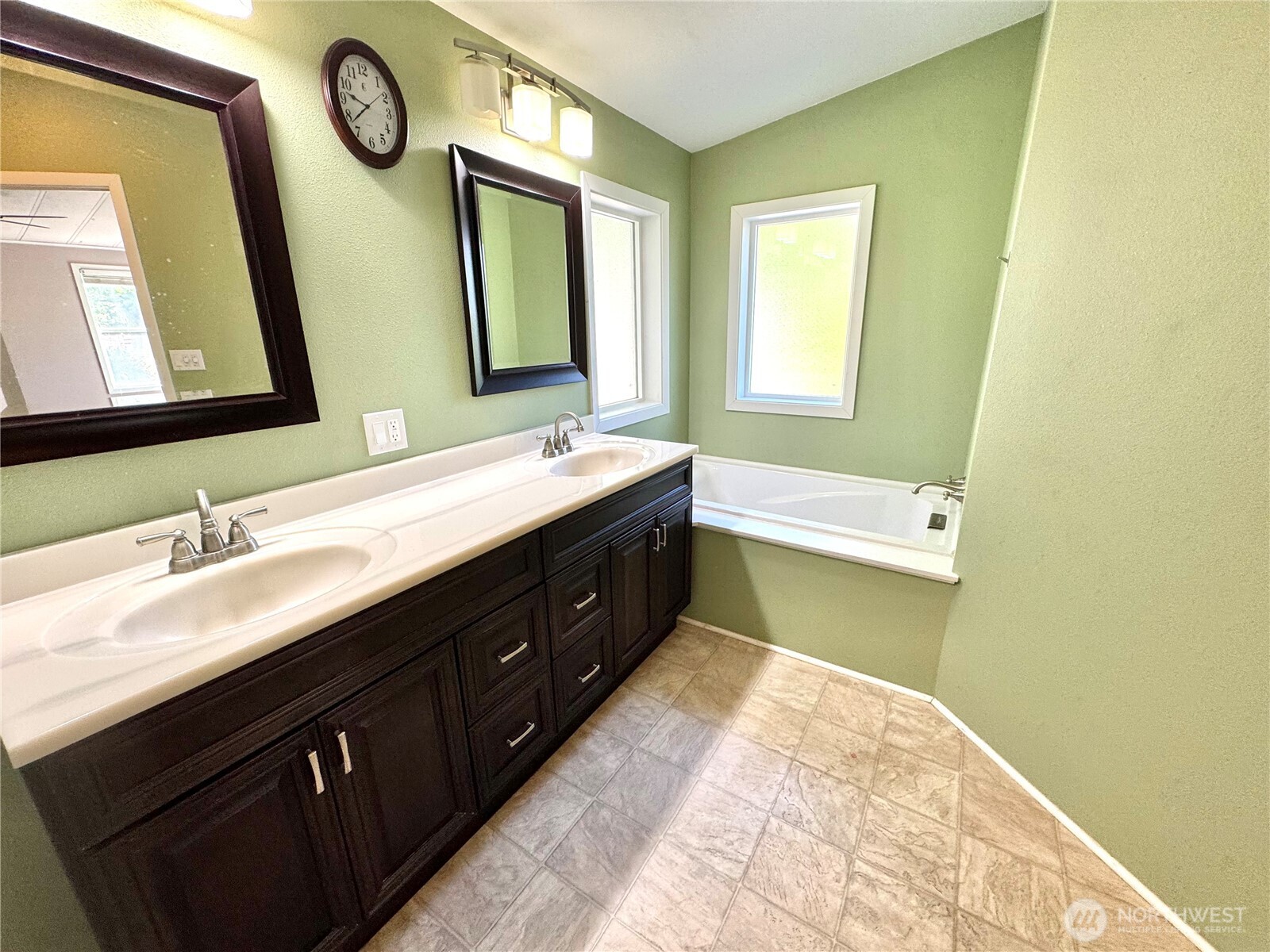 1218 South 3rd Street Dayton, WA 99328 - Photo 17 of 23 a spacious bathroom with a double vanity sink and a mirror