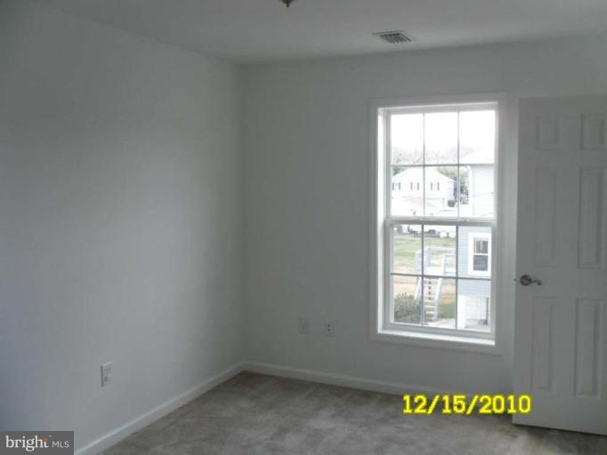 1311 Sulphur Spring Road Halethorpe, MD 21227 - Photo 8 of 16 an empty room with a window