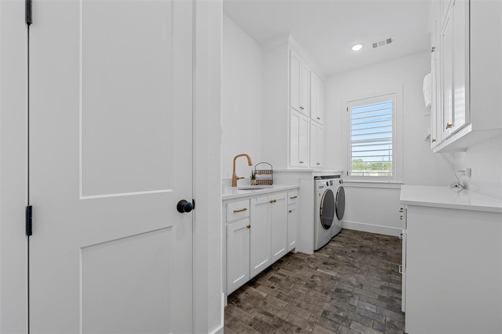 216 Wycliff Drive China Spring, TX 76633 - Photo 24 of 40 a utility room with cabinets washer and dryer
