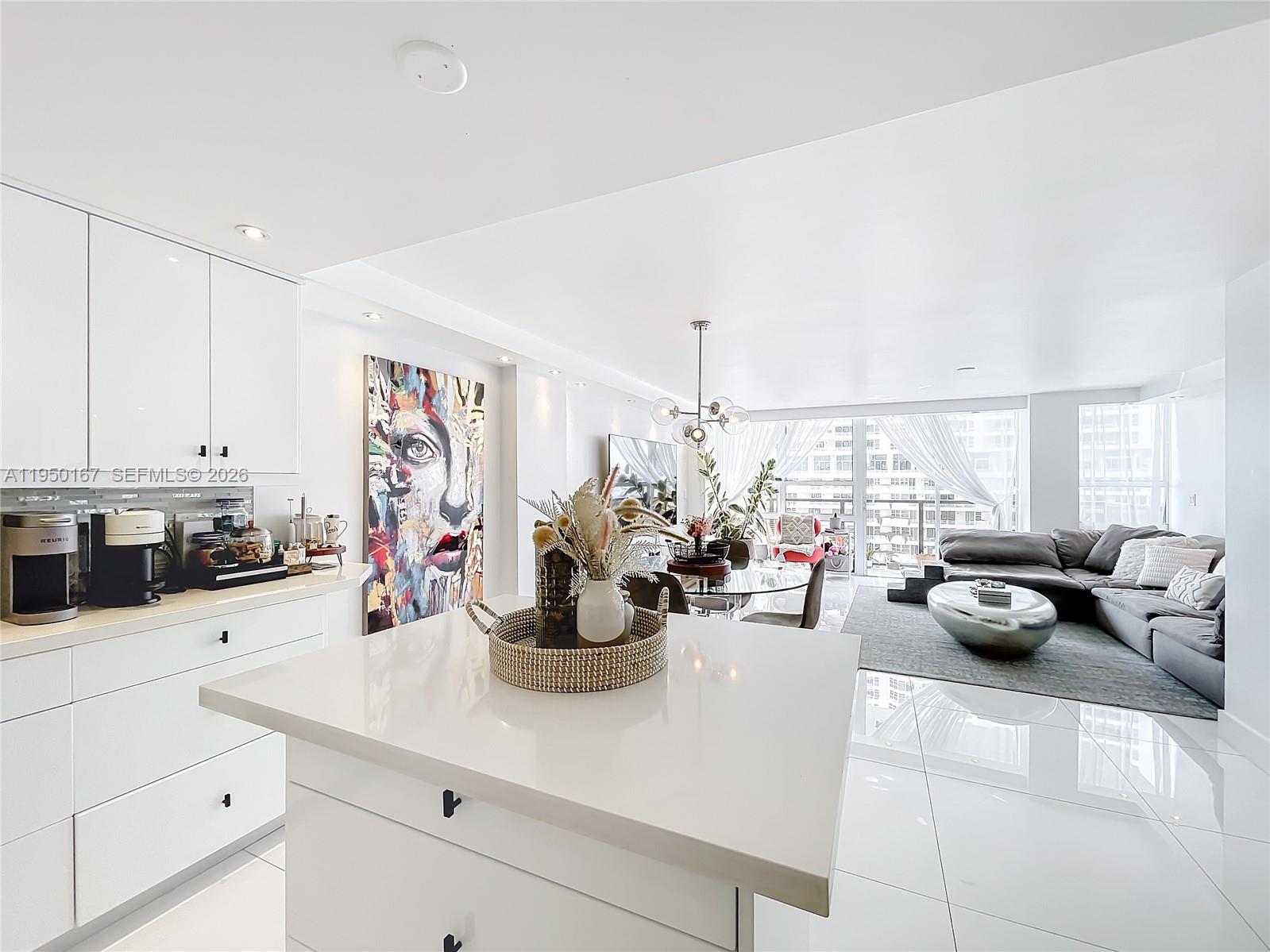 600 Northeast 36th Street, Unit 703 Miami, FL 33137 - Photo 12 of 48 a view of a kitchen with dining table and chairs