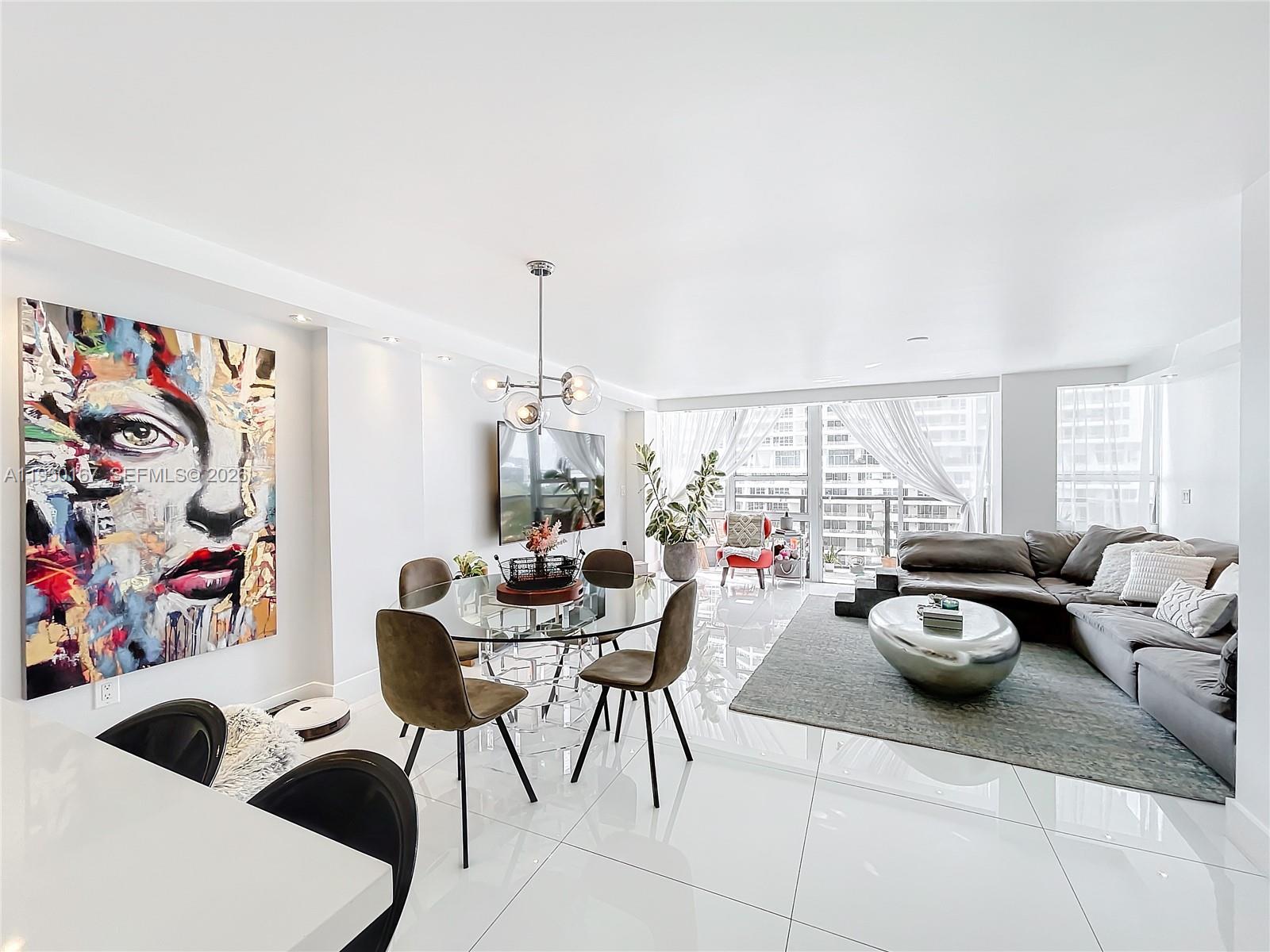 600 Northeast 36th Street, Unit 703 Miami, FL 33137 - Photo 14 of 48 a living room with furniture and a flat screen tv