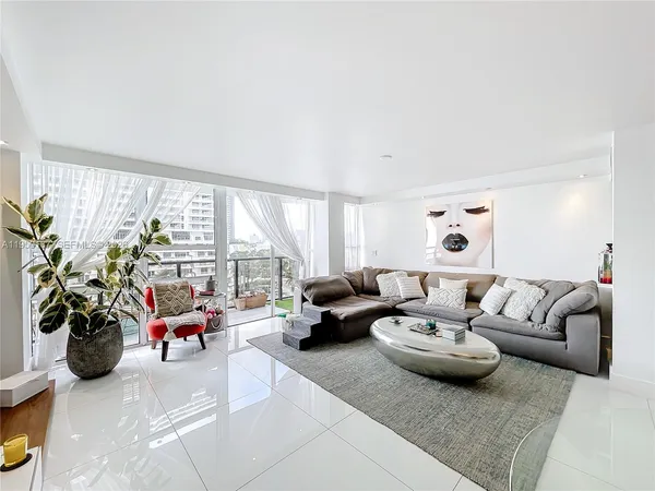 a living room with furniture and a table