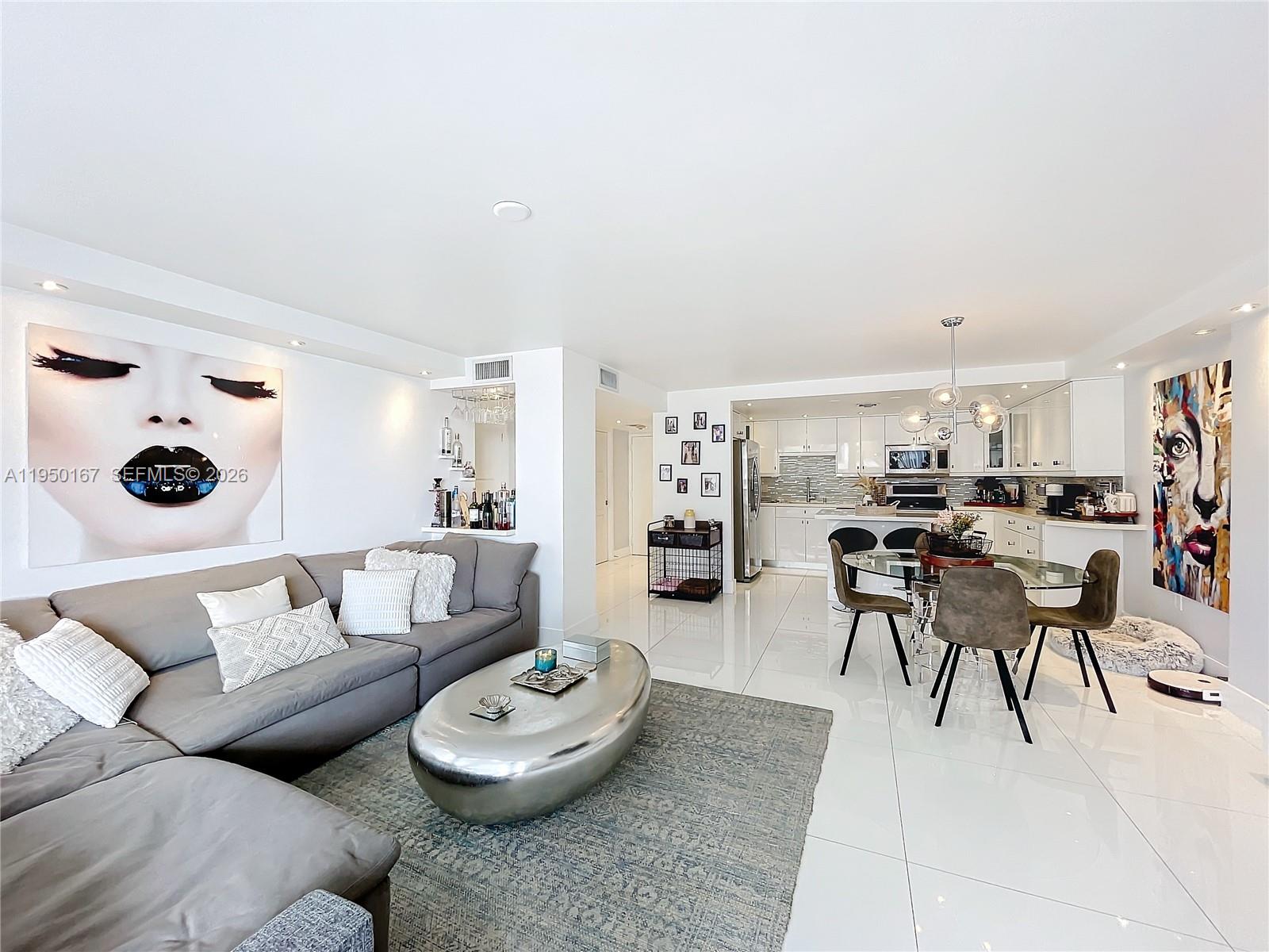 600 Northeast 36th Street, Unit 703 Miami, FL 33137 - Photo 20 of 48 a living room with furniture and a table