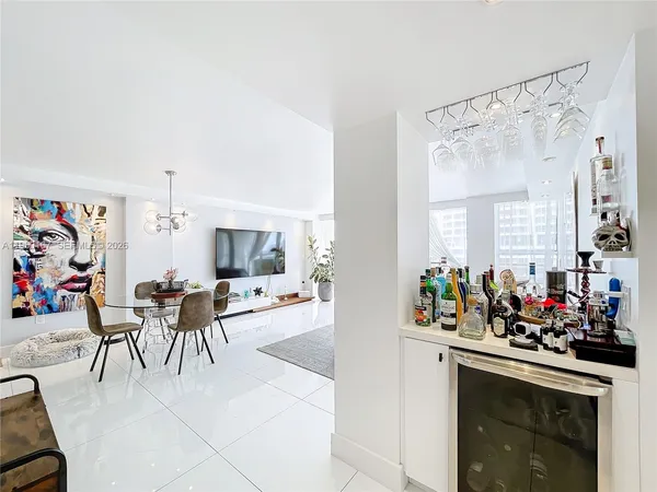 a view of a hallway and dining room
