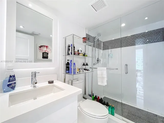 a living room with a flat screen tv and a couch