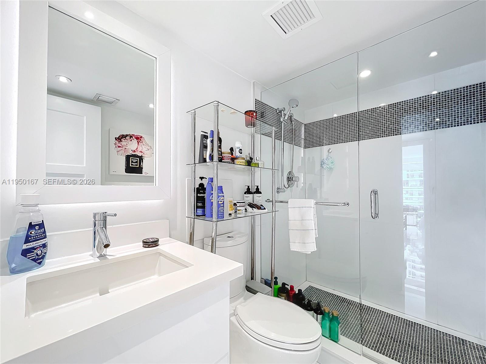 600 Northeast 36th Street, Unit 703 Miami, FL 33137 - Photo 30 of 48 a bathroom with a sink toilet and shower