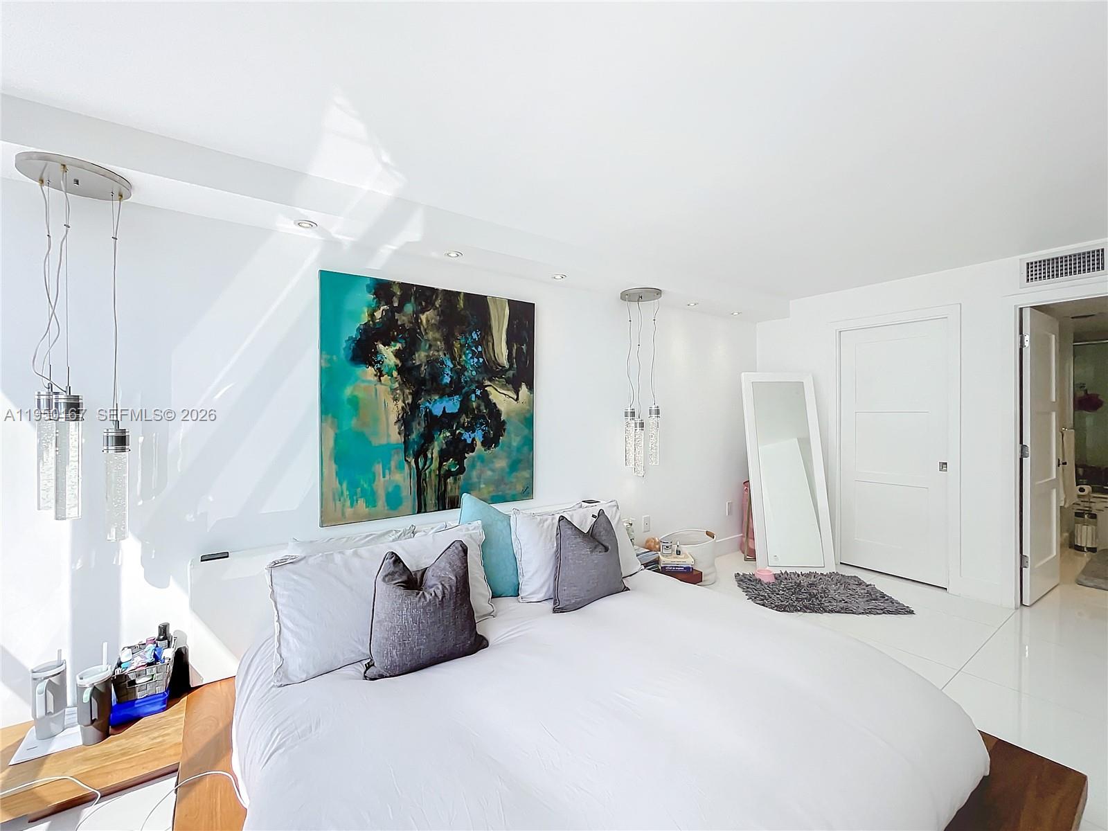 600 Northeast 36th Street, Unit 703 Miami, FL 33137 - Photo 34 of 48 a bedroom with a bed and a large window