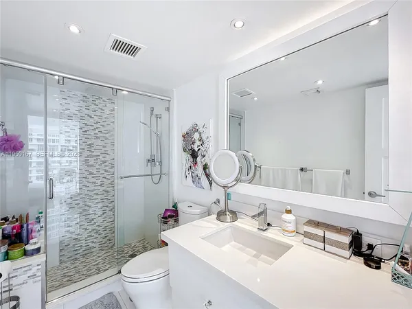 a view of a hallway with washer and dryer