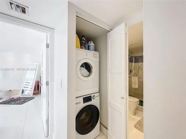 a room with furniture and a floor to ceiling window