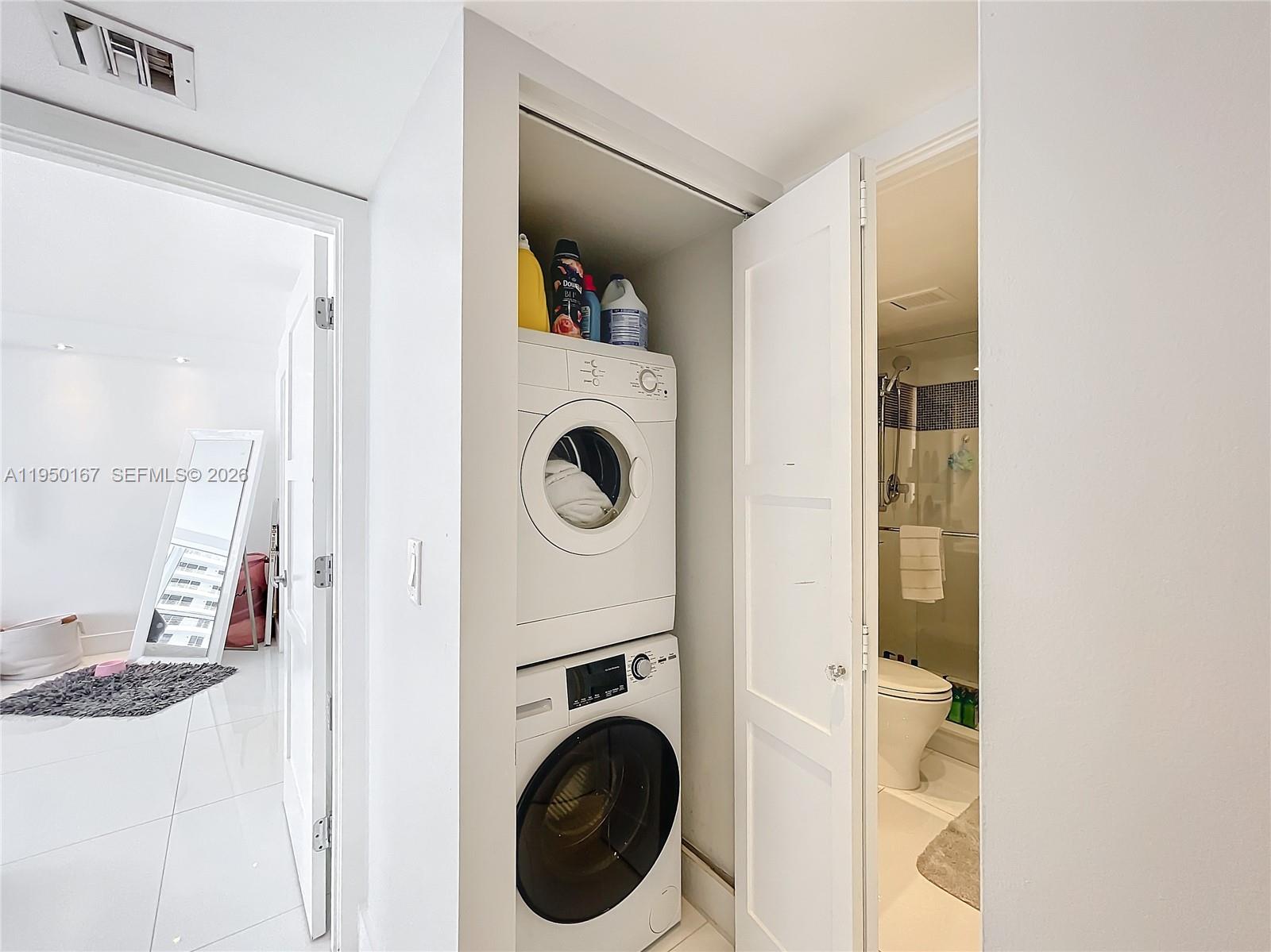 600 Northeast 36th Street, Unit 703 Miami, FL 33137 - Photo 37 of 48 a view of a hallway with washer and dryer