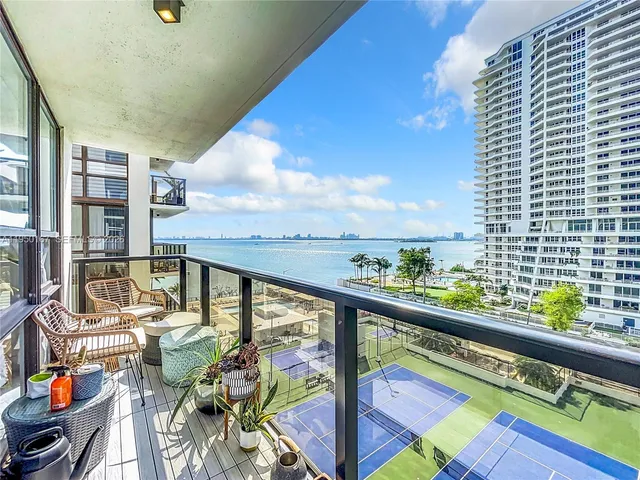 a view of a balcony with chairs
