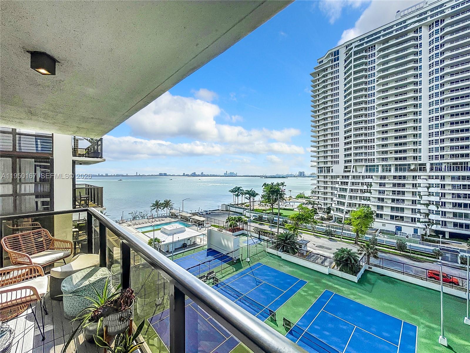 600 Northeast 36th Street, Unit 703 Miami, FL 33137 - Photo 40 of 48 a view of a balcony with chairs