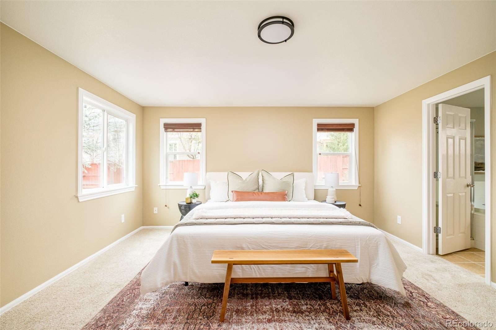 2147 Pinon Circle Erie, CO 80516 - Photo 12 of 34 a bed room with a bed and a window