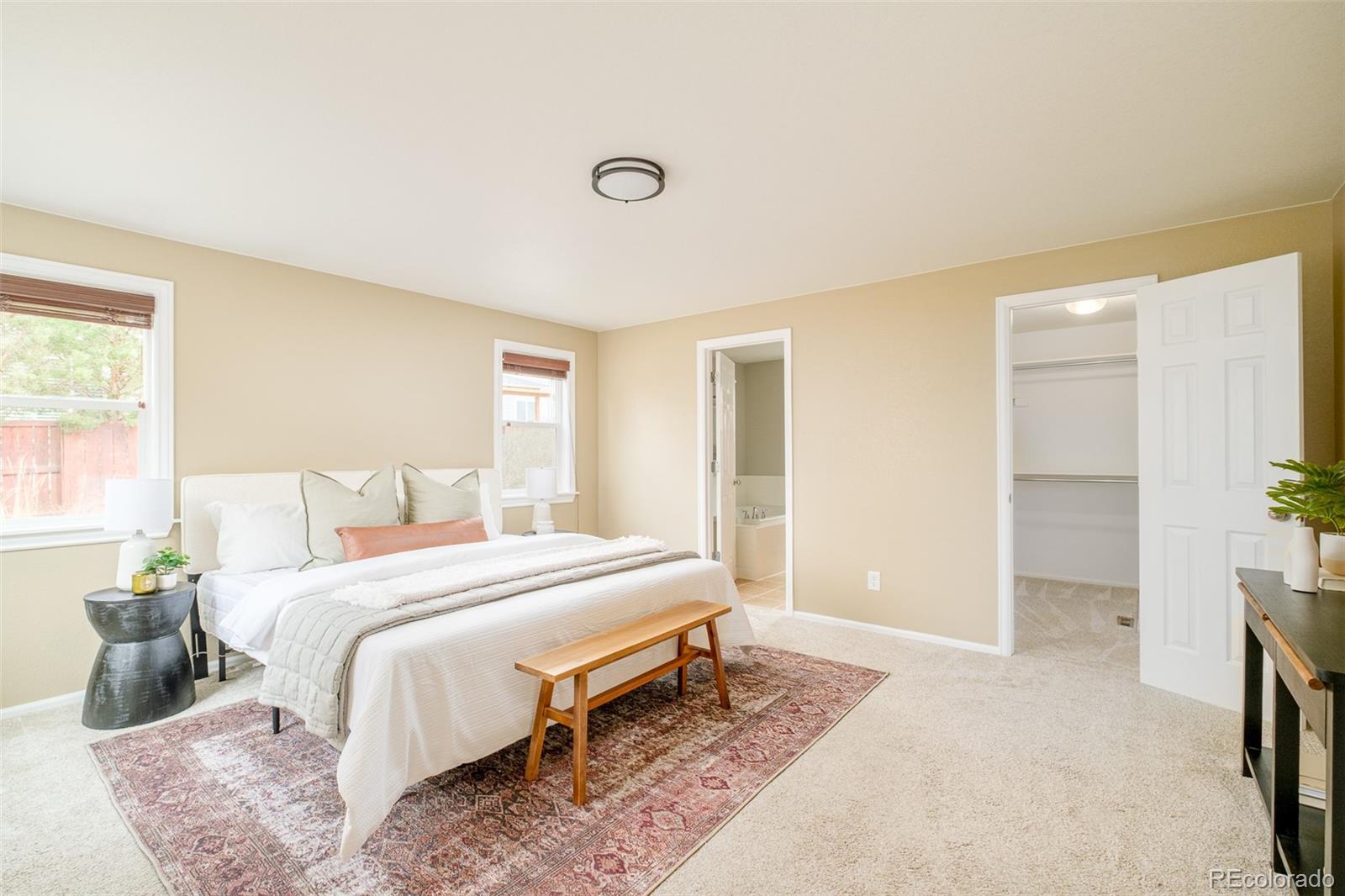 2147 Pinon Circle Erie, CO 80516 - Photo 13 of 34 a bedroom with a bed and a window