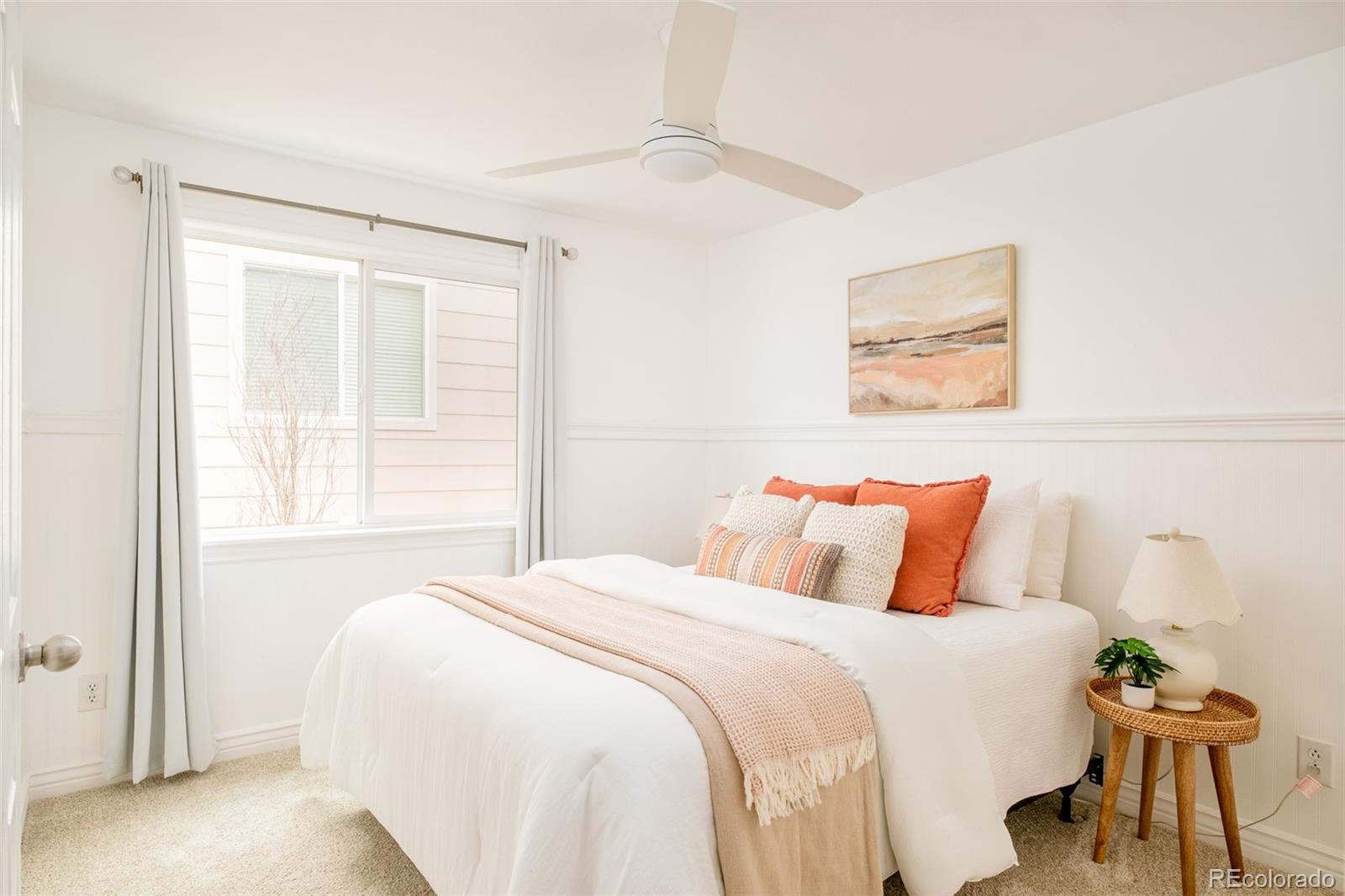 2147 Pinon Circle Erie, CO 80516 - Photo 16 of 34 a bedroom with a bed and a painting on the wall