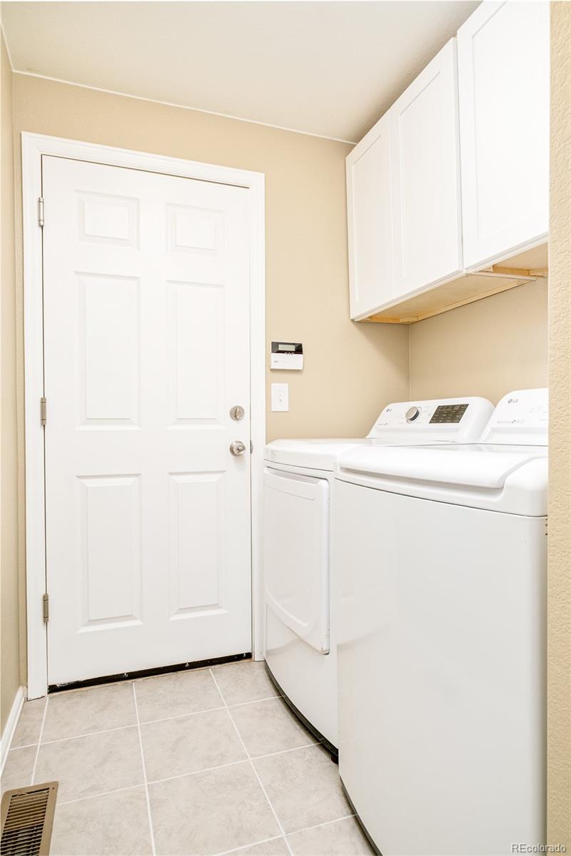 2147 Pinon Circle Erie, CO 80516 - Photo 20 of 34 a utility room with dryer and washer