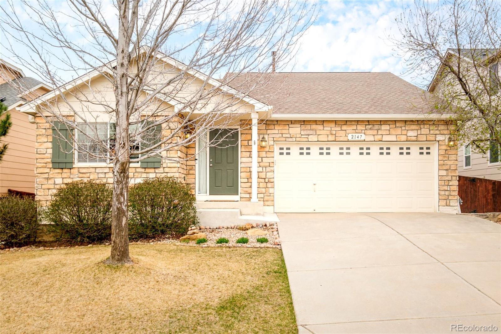 2147 Pinon Circle Erie, CO 80516 - Photo 2 of 34 a view of a backyard with large trees