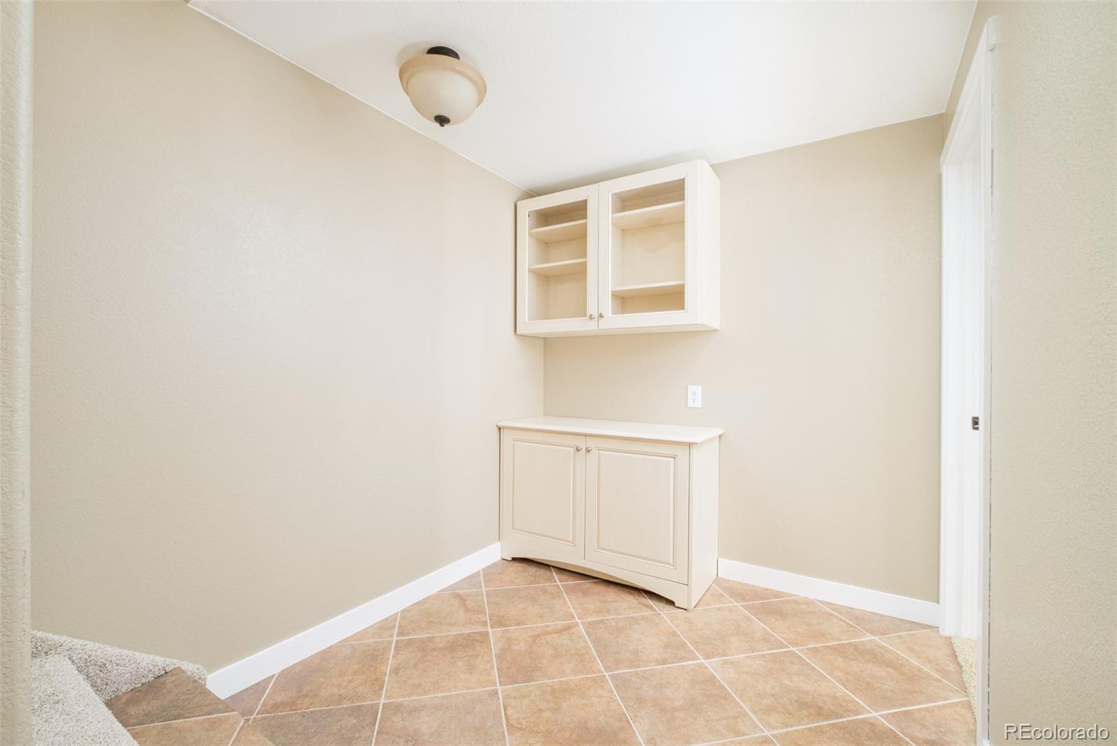 2147 Pinon Circle Erie, CO 80516 - Photo 21 of 34 a view of an empty room with windows