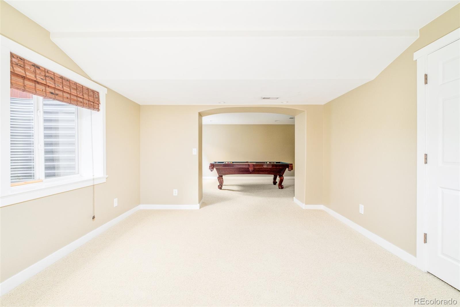 2147 Pinon Circle Erie, CO 80516 - Photo 23 of 34 a view of an empty room with a window