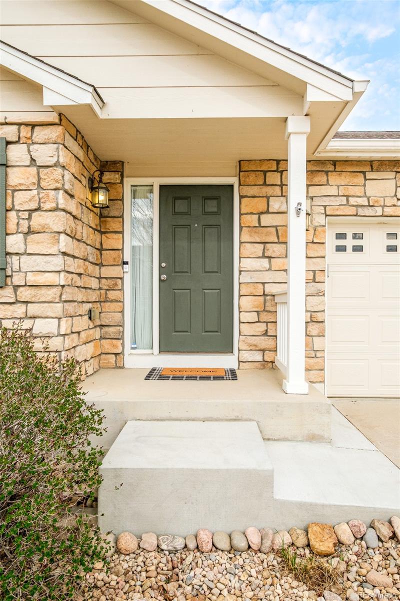 2147 Pinon Circle Erie, CO 80516 - Photo 34 of 34 a front view of a house with a road