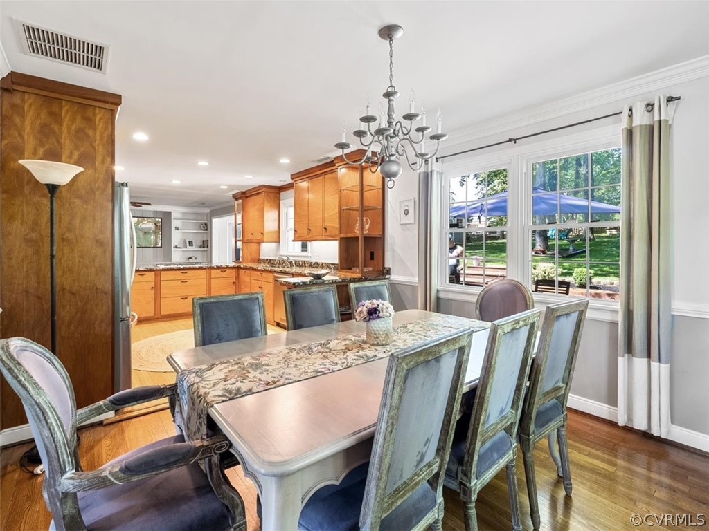 7540 Marilea Road Richmond, VA 23225 - Photo 7 of 35 a view of a dining room with furniture window and wooden floor