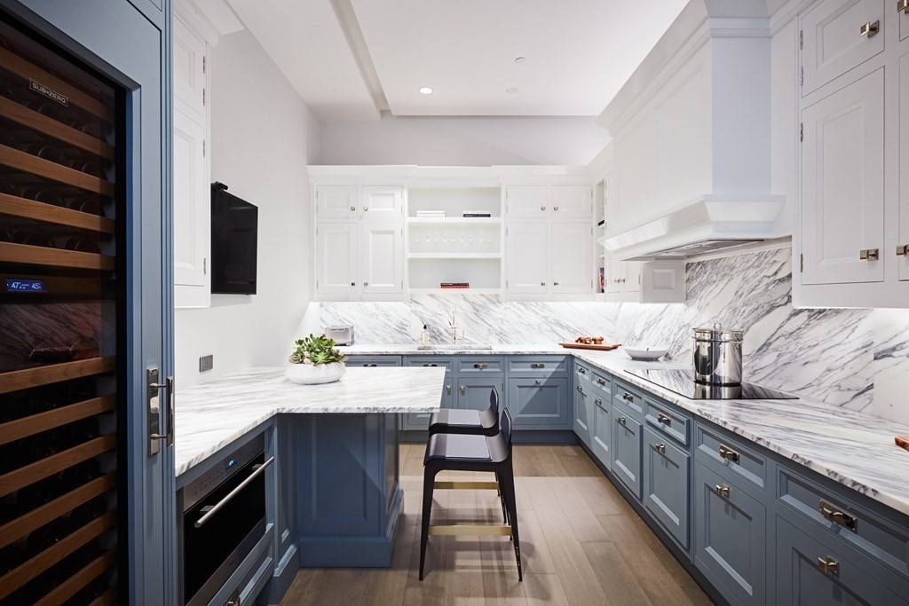 240 Devonshire Street, Unit PH 2B Boston, MA 02110 - Photo 2 of 38 a kitchen with stainless steel appliances a sink window and cabinets