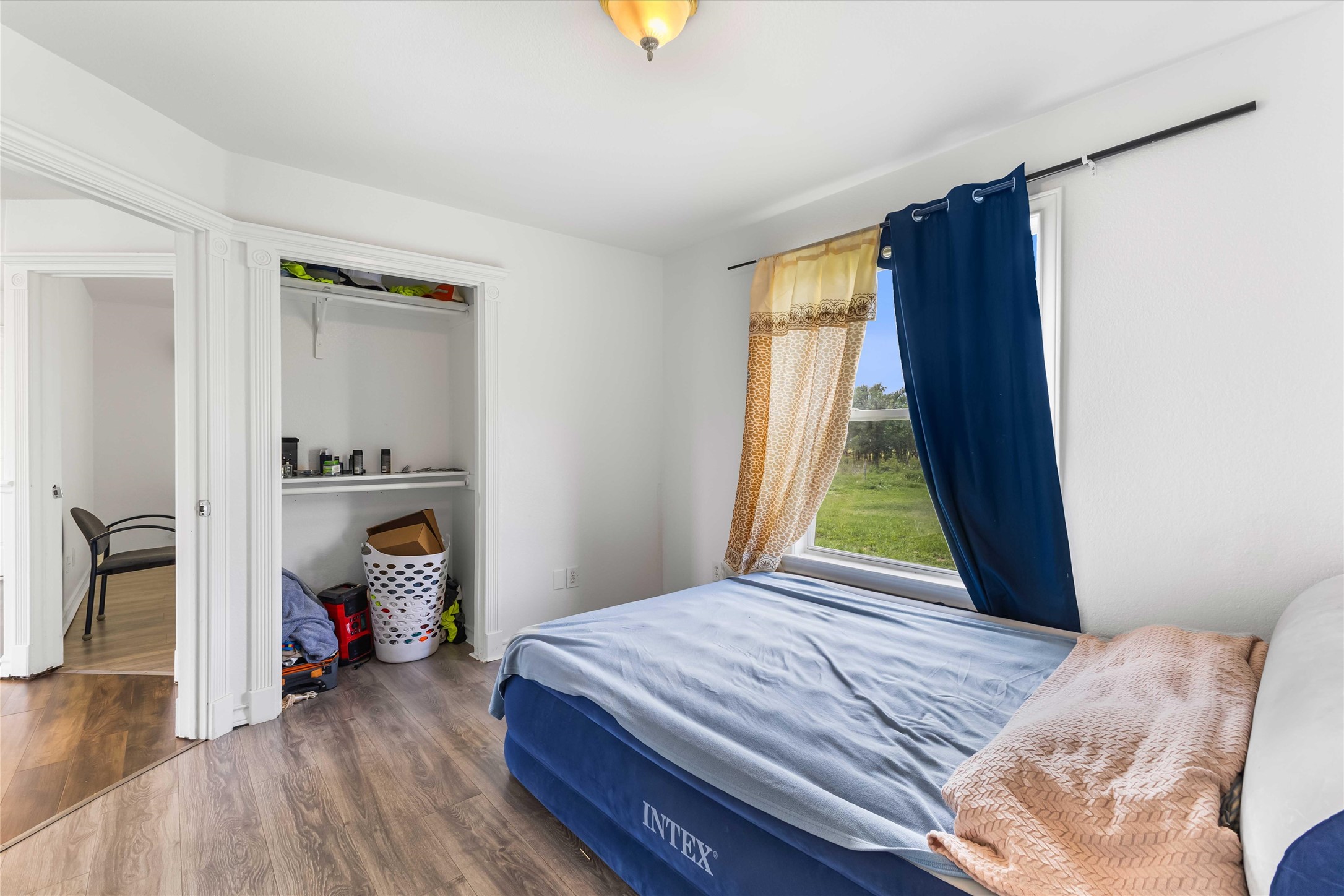 12212 Ballerstedt Road Elgin, TX 78621 - Photo 22 of 39 a bedroom with a bed and a window