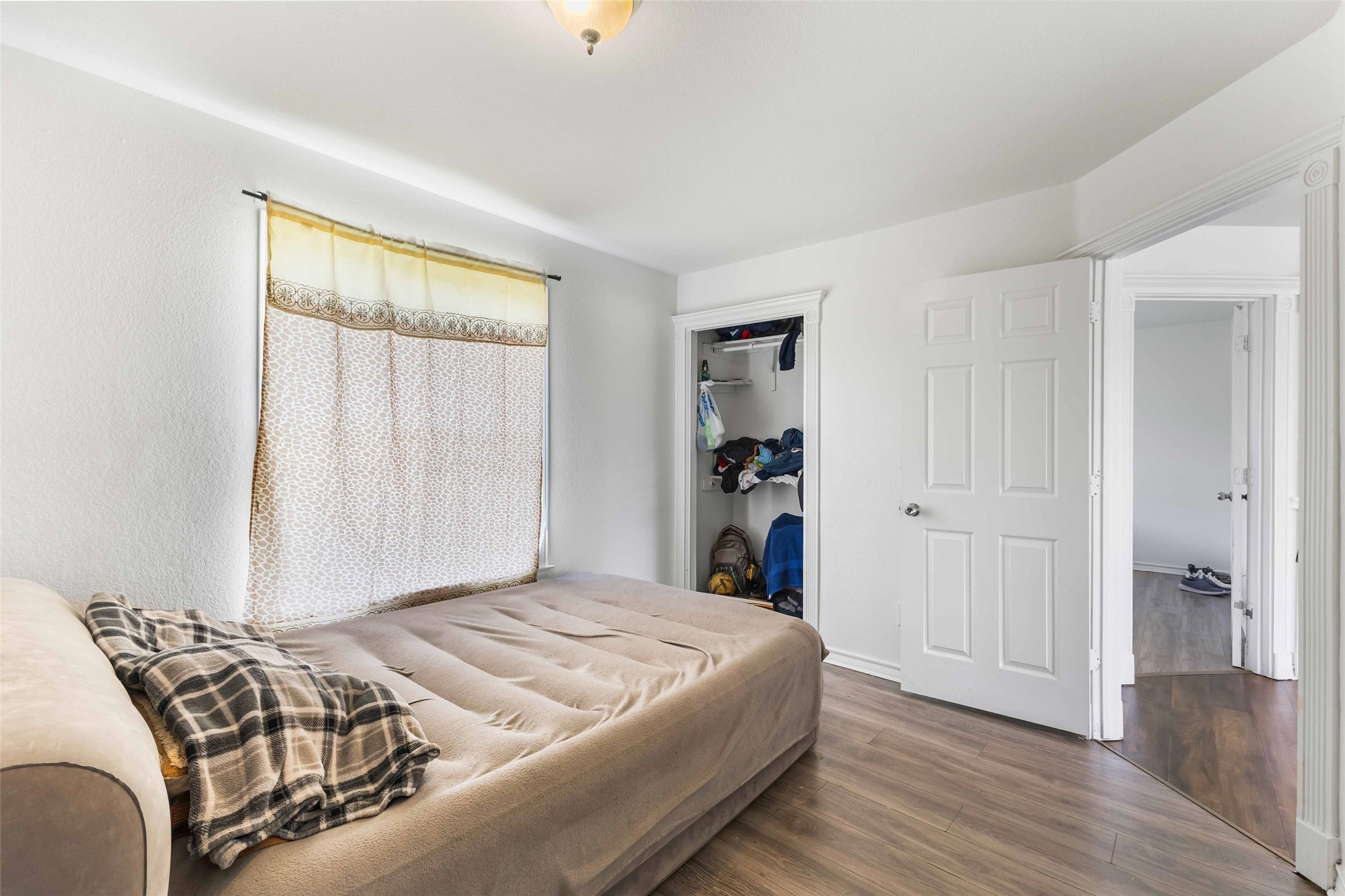12212 Ballerstedt Road Elgin, TX 78621 - Photo 24 of 39 a bedroom with a bed and a window