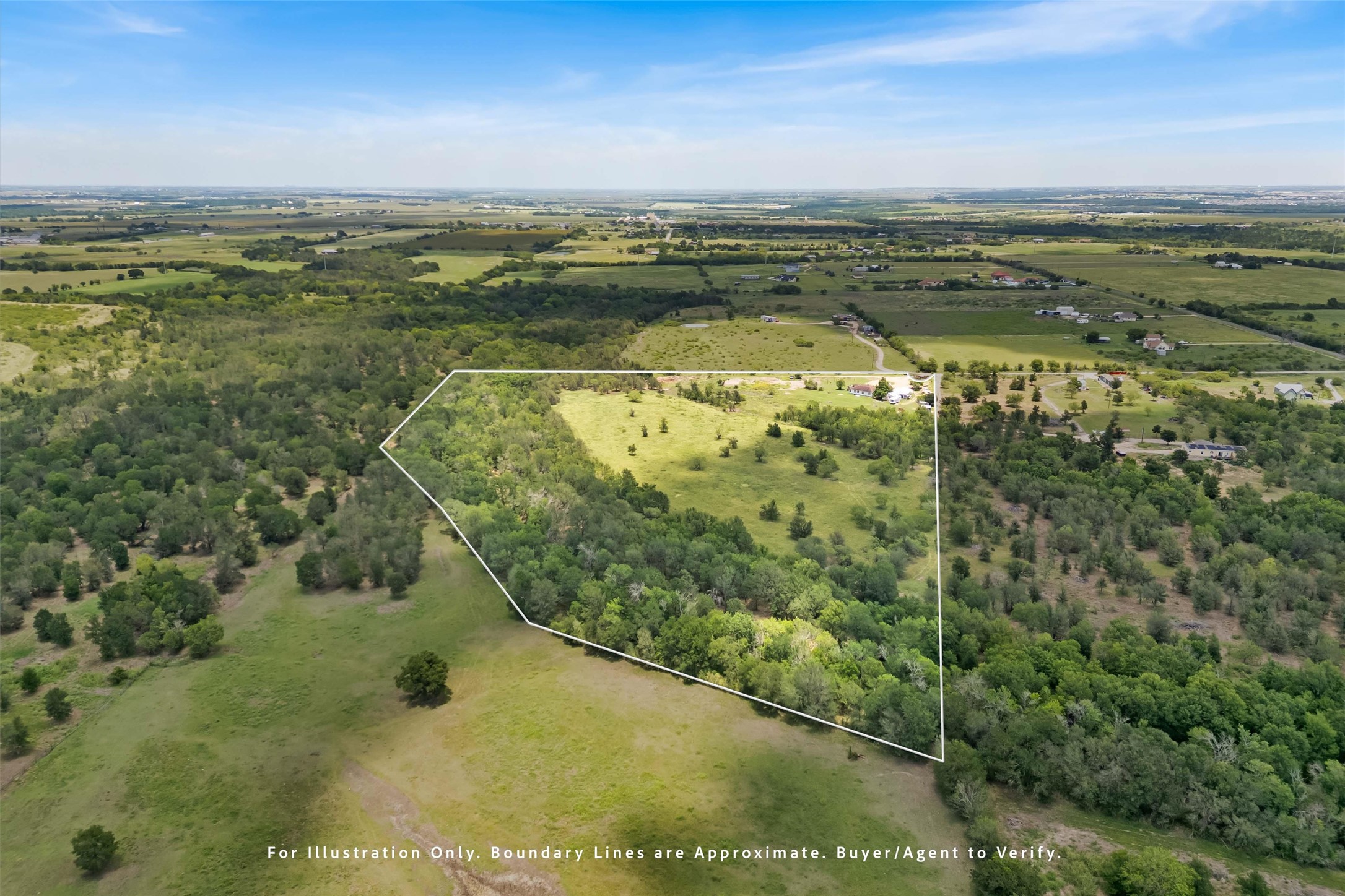 12212 Ballerstedt Road Elgin, TX 78621 - Photo 38 of 39 a view of a lake with a yard