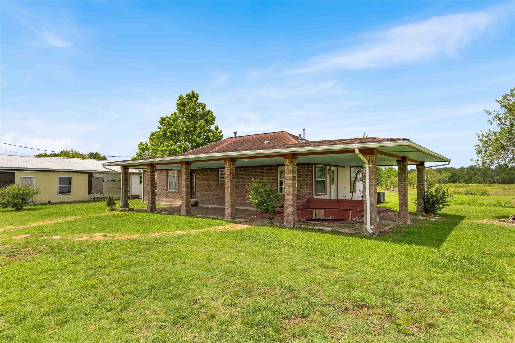 12212 Ballerstedt Road Elgin, TX 78621 - Photo 4 of 39 a view of a house with a yard and sitting area
