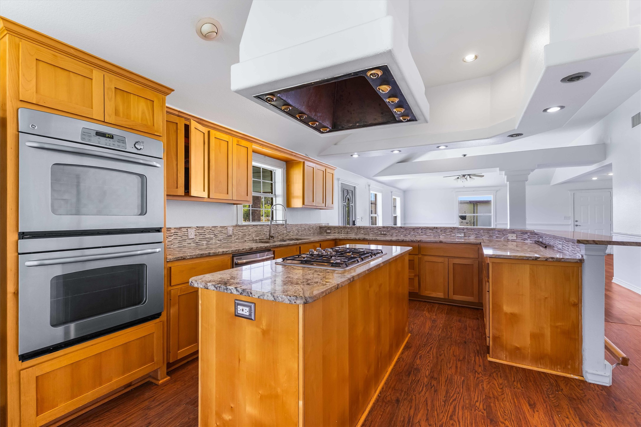 12212 Ballerstedt Road Elgin, TX 78621 - Photo 10 of 39 a kitchen with stainless steel appliances granite countertop a stove and a sink