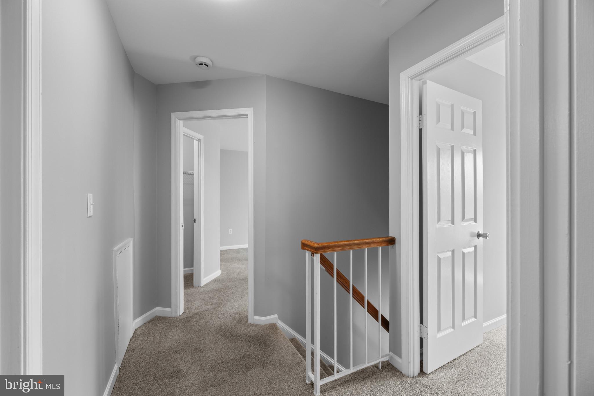 9302 Player Drive, Unit 155 Laurel, MD 20708 - Photo 28 of 43 a view of a hallway with staircase