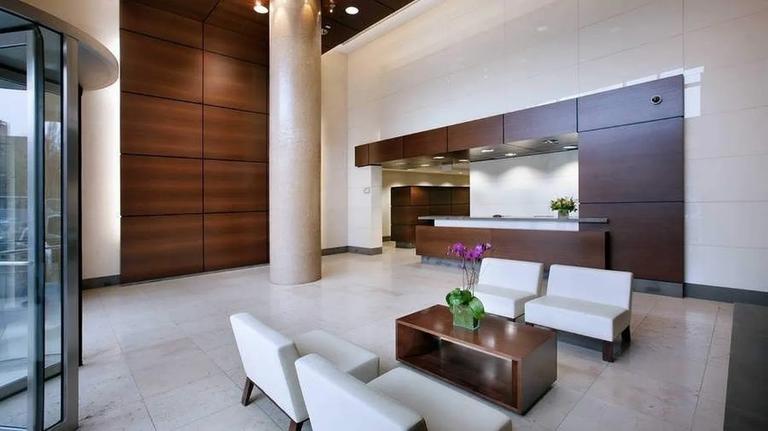 306 Gold Street, Unit 16D Brooklyn, NY 11201 - Photo 7 of 15 a living room with furniture and a fireplace