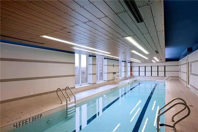 306 Gold Street, Unit 16D Brooklyn, NY 11201 - Photo 8 of 15 a view of a hallway with two chairs