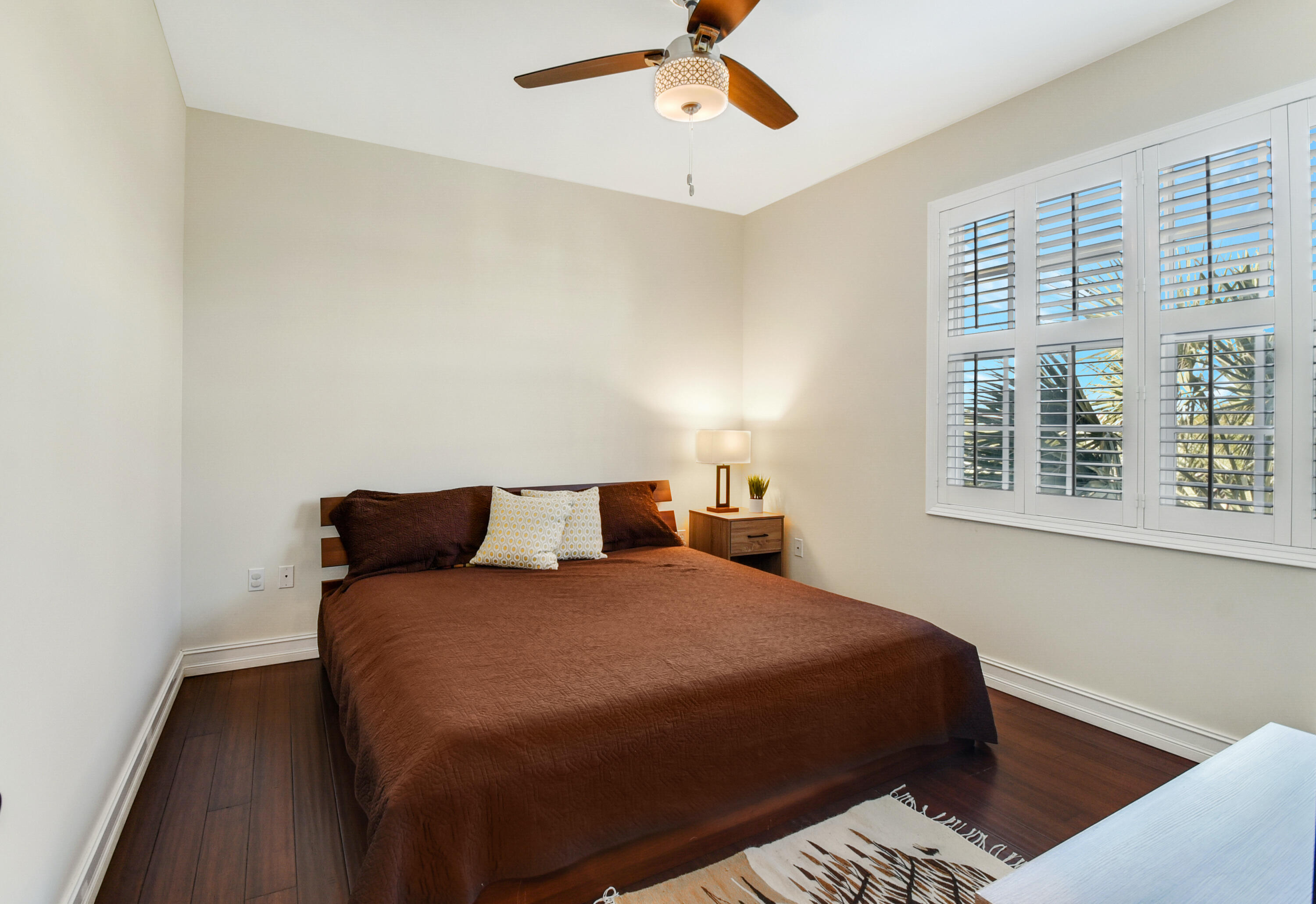 609 Renaissance Way Delray Beach, FL 33483 - Photo 14 of 22 a bedroom with a bed and window