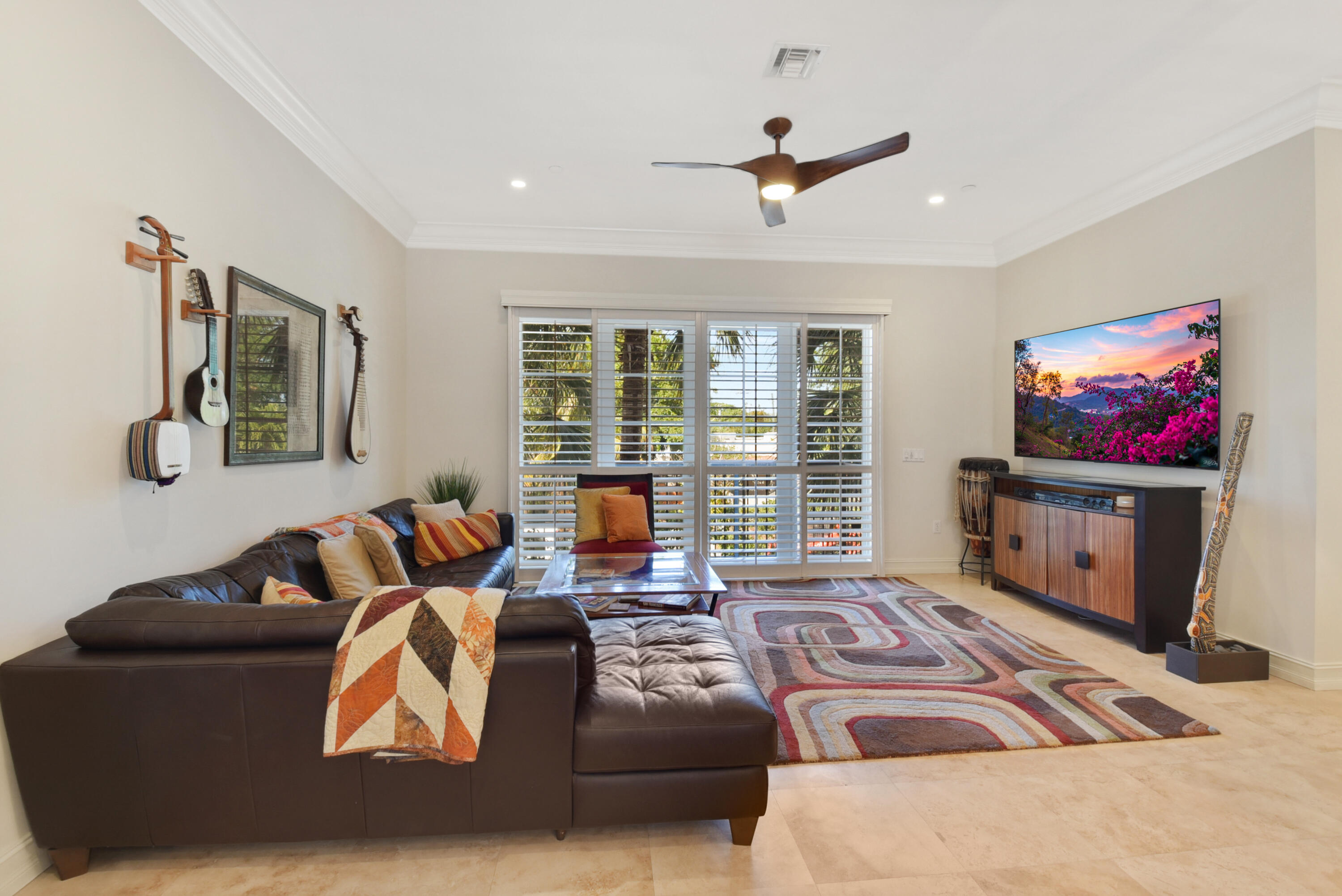 609 Renaissance Way Delray Beach, FL 33483 - Photo 7 of 22 a living room with furniture and a flat screen tv