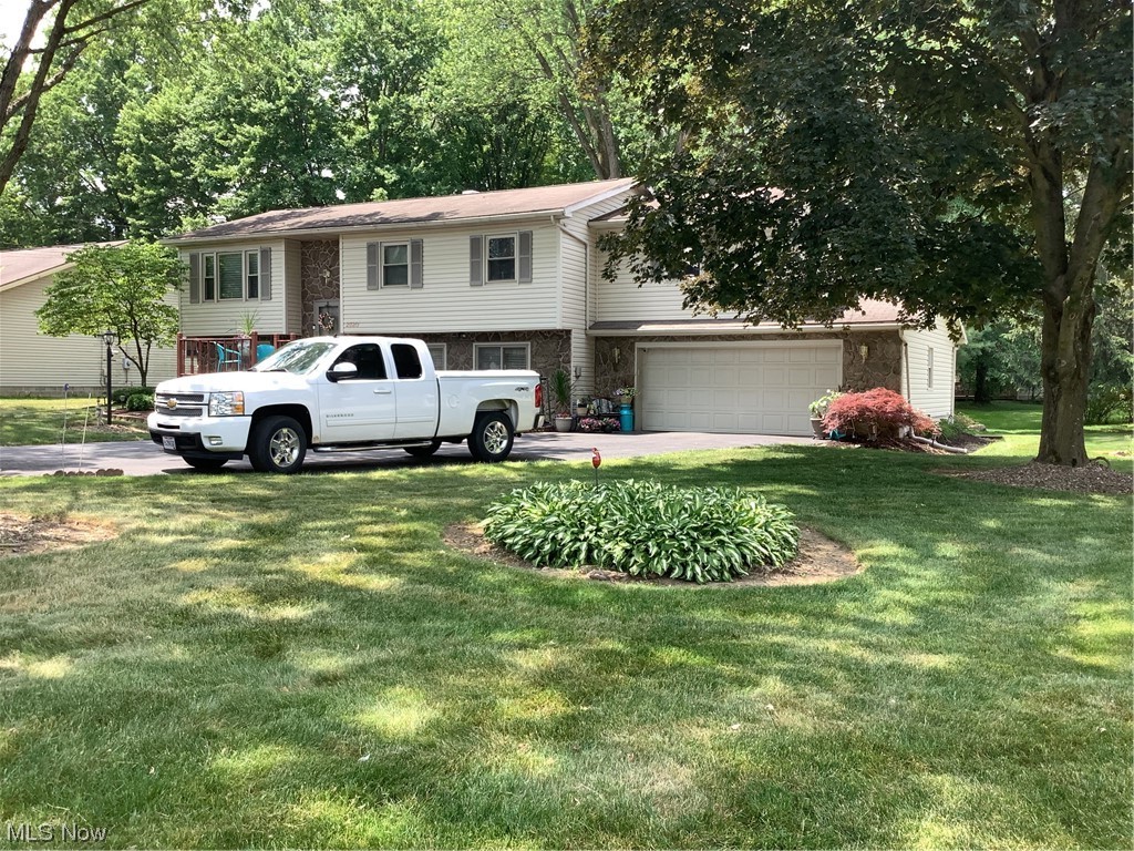 2320 South Meridian Road Austintown, OH 44511 - Photo 2 of 24 View of front of home featuring a front yard and a garage